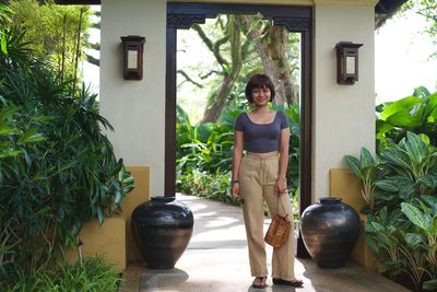 Young woman standing in yard
