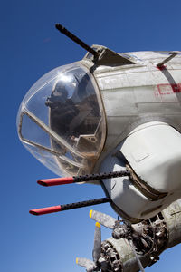 Low angle view of airplane against clear sky