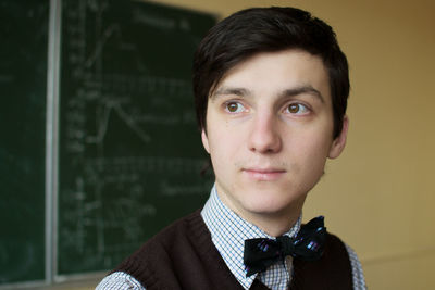 Portrait of young man standing outdoors