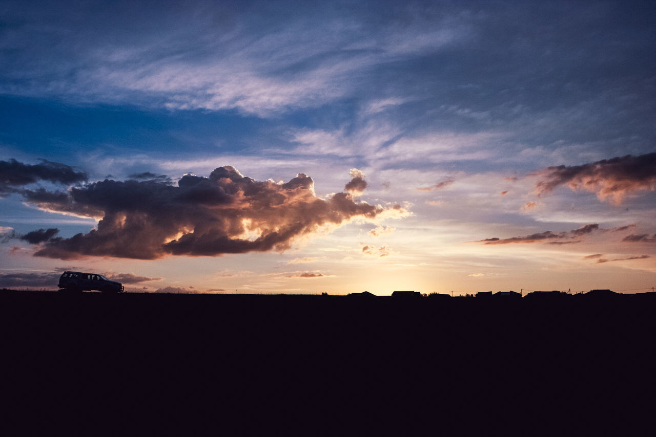 sky, cloud, sunset, environment, horizon, beauty in nature, landscape, nature, dawn, scenics - nature, dramatic sky, afterglow, silhouette, no people, evening, tranquility, cloudscape, sunlight, outdoors, land, tranquil scene, red sky at morning, sun, blue, travel, orange color, idyllic, copy space, travel destinations