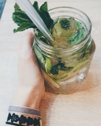 Close-up of hand holding drink