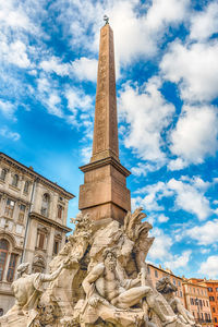 Low angle view of statue against sky