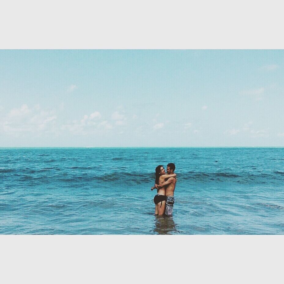 sea, horizon over water, water, standing, rear view, lifestyles, leisure activity, sky, transfer print, full length, scenics, tranquil scene, tranquility, beauty in nature, person, blue, nature, auto post production filter