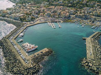 High angle view of cityscape by sea