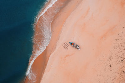 Aerial view of boat moored on beach