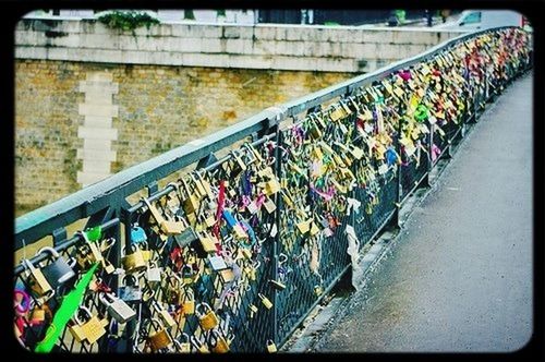 transportation, metal, bridge - man made structure, multi colored, railing, connection, mode of transport, large group of objects, in a row, abundance, high angle view, metallic, variation, land vehicle, outdoors, built structure, no people, day, bicycle, architecture