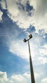 Low angle view of floodlight against sky