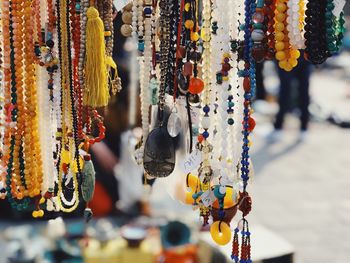 Close-up of multi colored hanging for sale in market