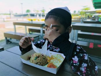 Portrait of man eating food