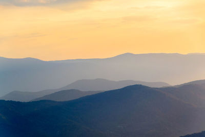 Scenic view of mountains against sky during sunset