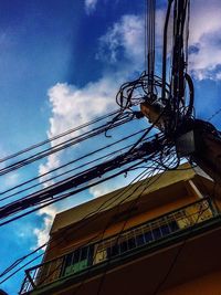 Low angle view of ferris wheel against sky