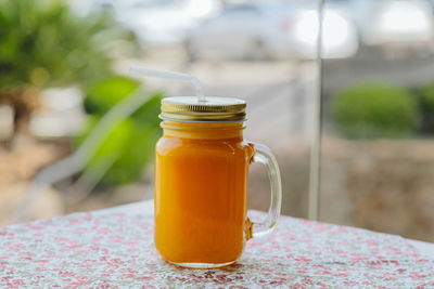 Close-up of drink in jar on table