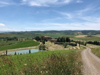 Scenic view of agricultural field against sky