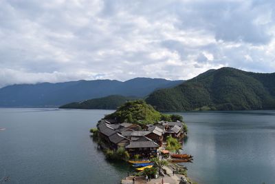 Scenic view of lake and mountains against sky