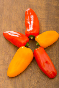 High angle view of red chili peppers on table