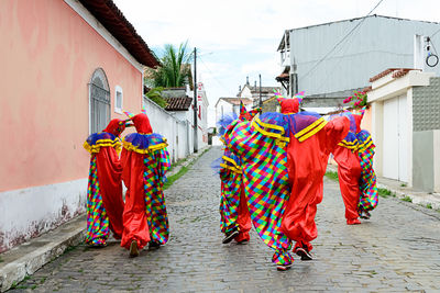 Group of people wearing venice carnival costumes during the carnival 