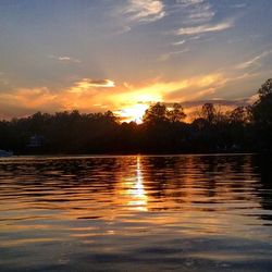 Scenic view of lake at sunset