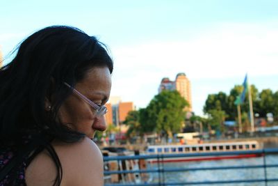 Close-up of woman against sky