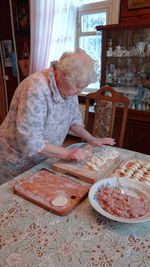 Senior woman preparing food