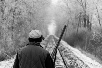 A hunter watching the trail rails
