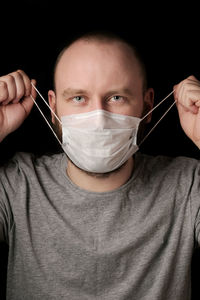 Close-up portrait of man wearing mask