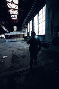 Full length of man standing in corridor