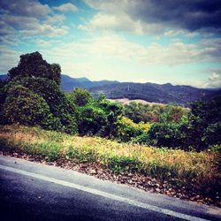 Scenic view of landscape against cloudy sky