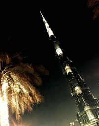 Low angle view of illuminated building at night