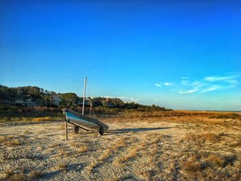 Scenic view of field against clear blue sky