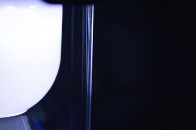 Close-up of glass over black background