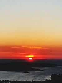 Scenic view of sea against romantic sky at sunset