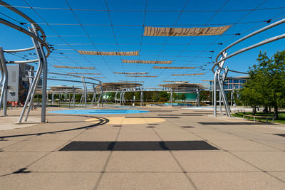 View of footpath against blue sky