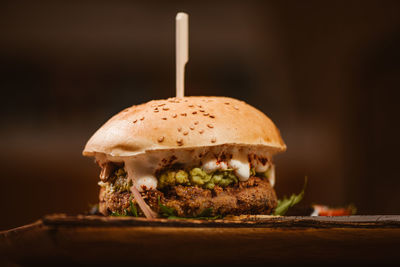 Close-up of burger against white background