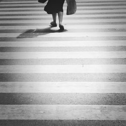 Low section of people walking on road