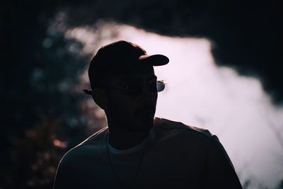 Portrait of silhouette man standing against sky during sunset