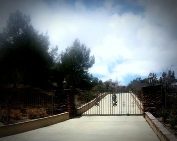 Footbridge leading towards trees