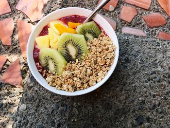 Close-up of breakfast in bowl on rock