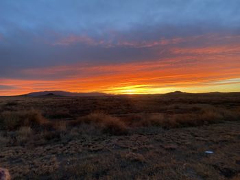 Scenic view of landscape against sky during sunset