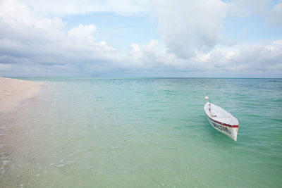 Boat in sea against sky