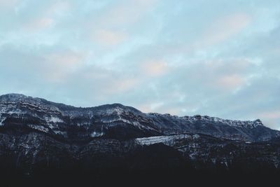 Scenic view of mountains against sky during winter