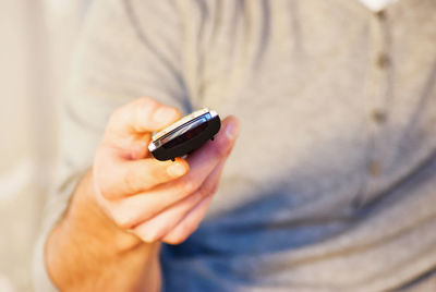 Close-up of person hand holding mobile phone