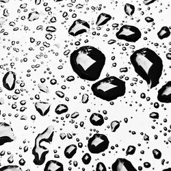 Full frame shot of water drops on metallic surface
