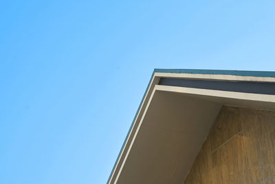 Low angle view of building against clear blue sky