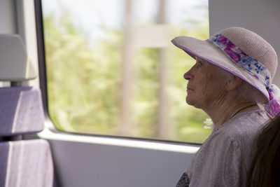 Senior woman traveling in train