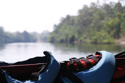 Close-up of boat in lake against sky