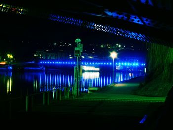 Illuminated built structure against sky at night