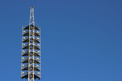 Low angle view of floodlight against clear sky