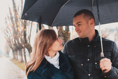 Couple kissing in rain