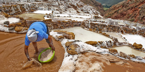 Man working at salt pans of maras
