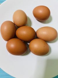 High angle view of eggs in plate on table